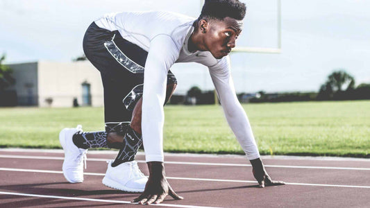 Runner on the track, in a starter position