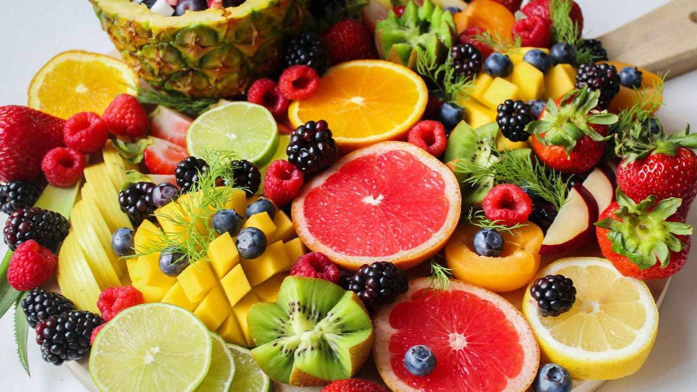 a plate full of different kinds of fruits
