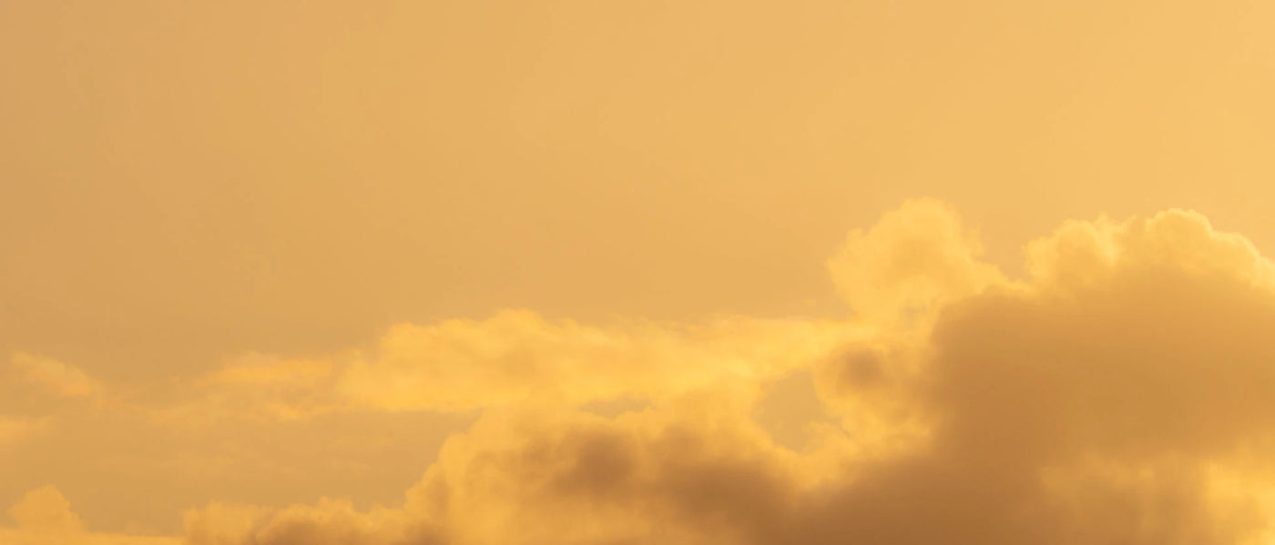 clouds on a yellowish sky during daytime