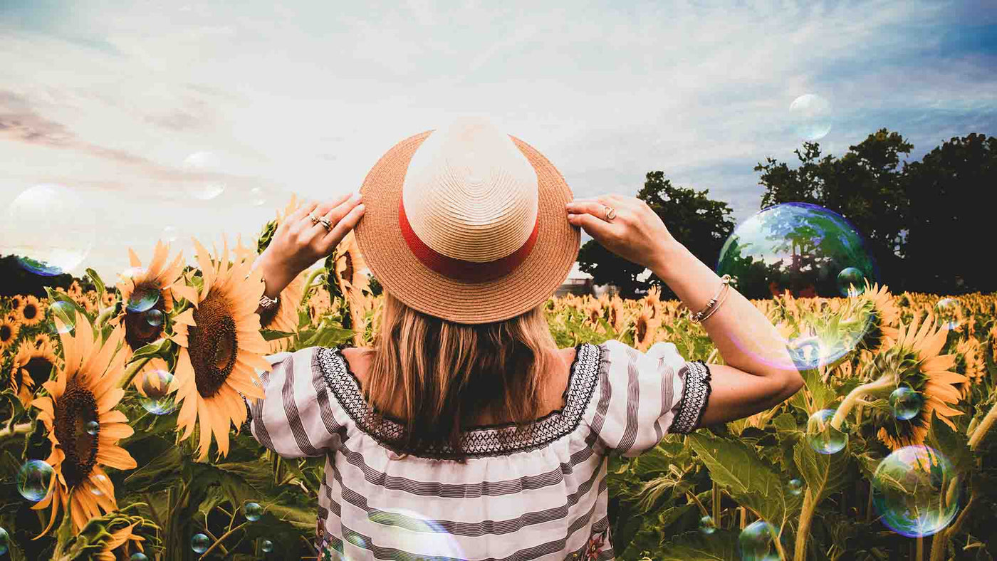 Woman in a field of sunflowers