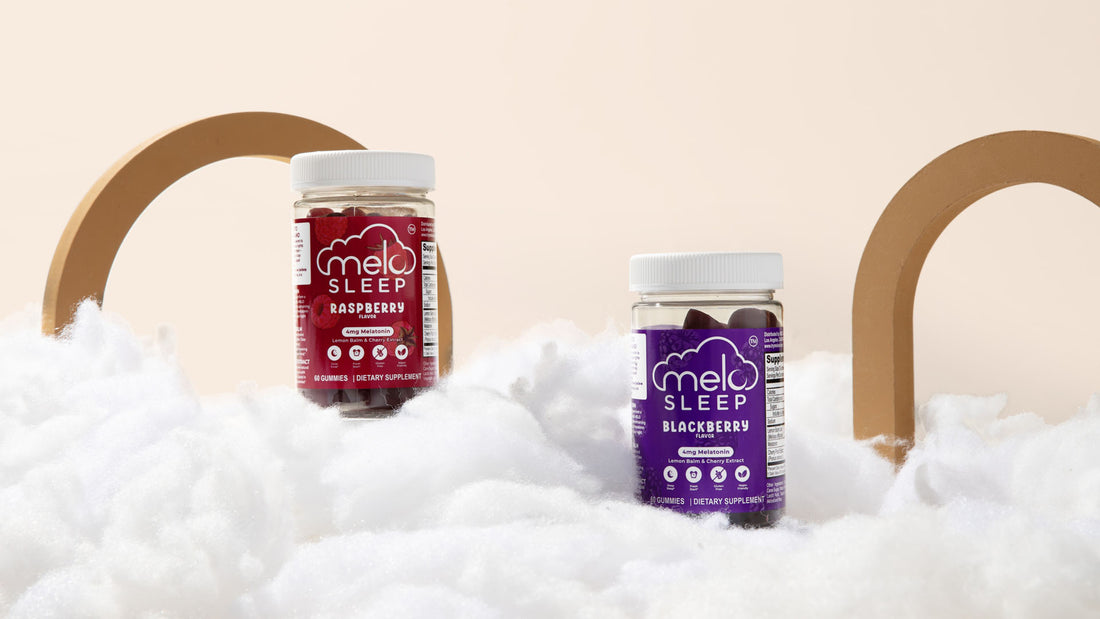 two bottles of MELO sleep gummies in a cloud-like surface