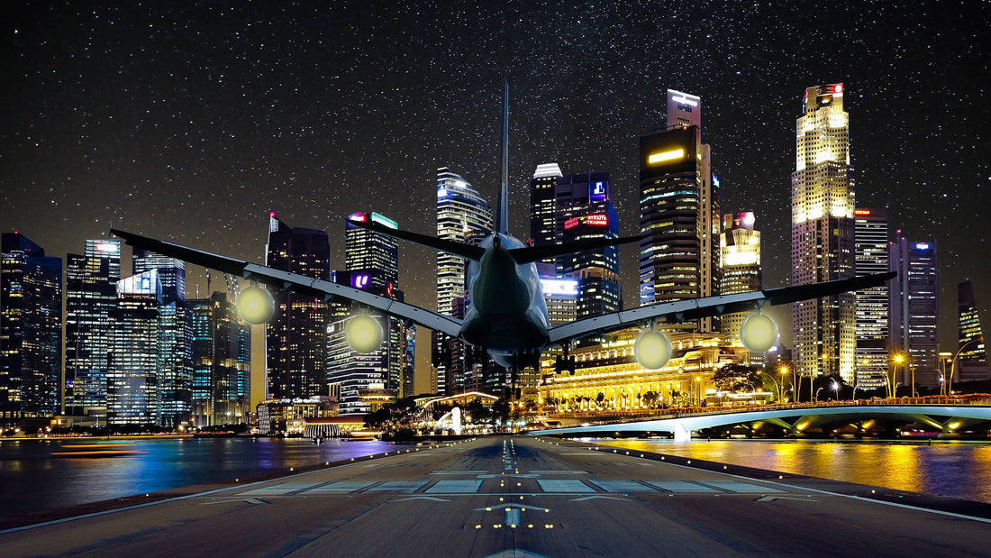 An airplane landing on a runway at night.