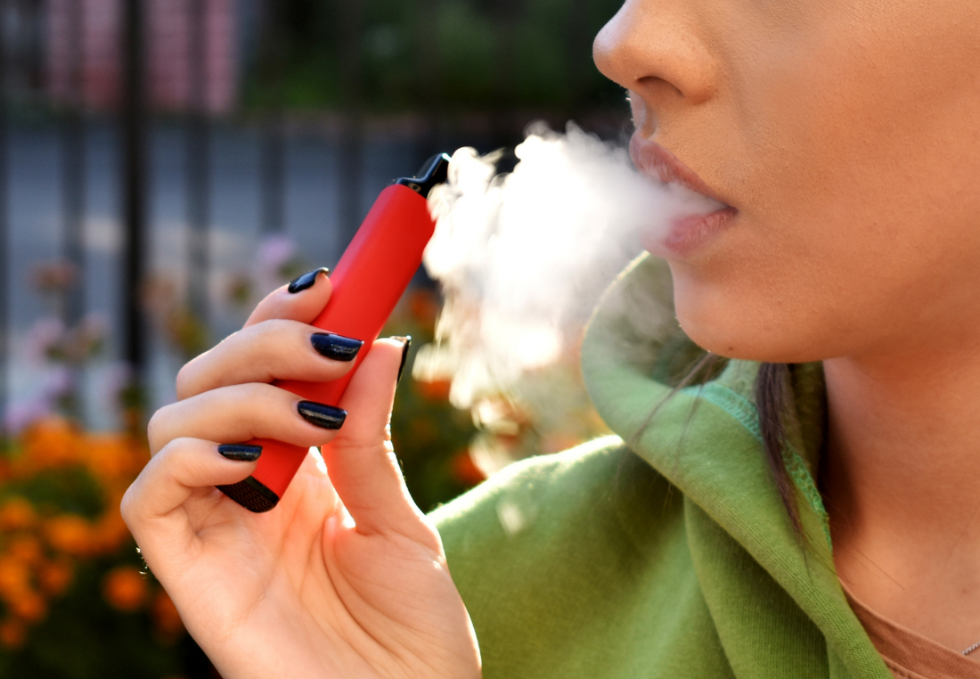 Women vaping with a no nicotine diffuser