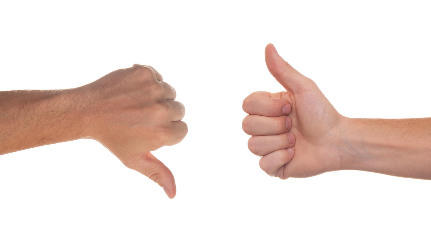 two hands showing thumbs up and thumbs down