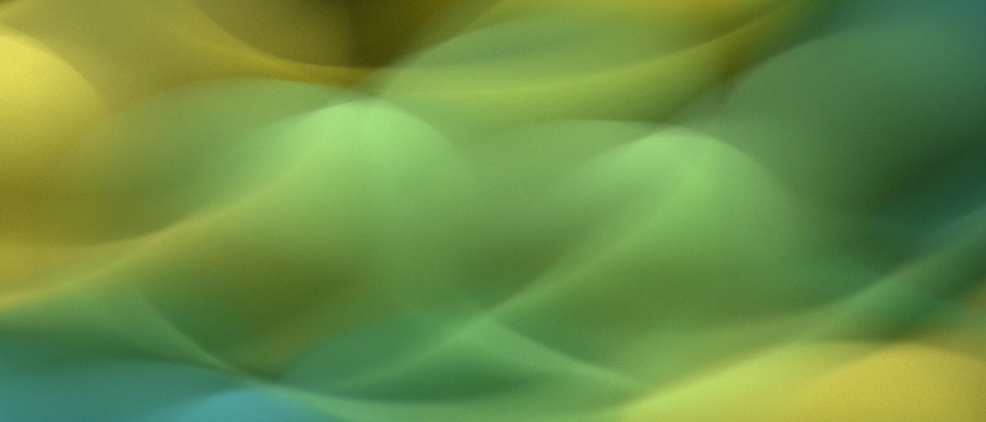 blurred image of green, yellow, and blue colors