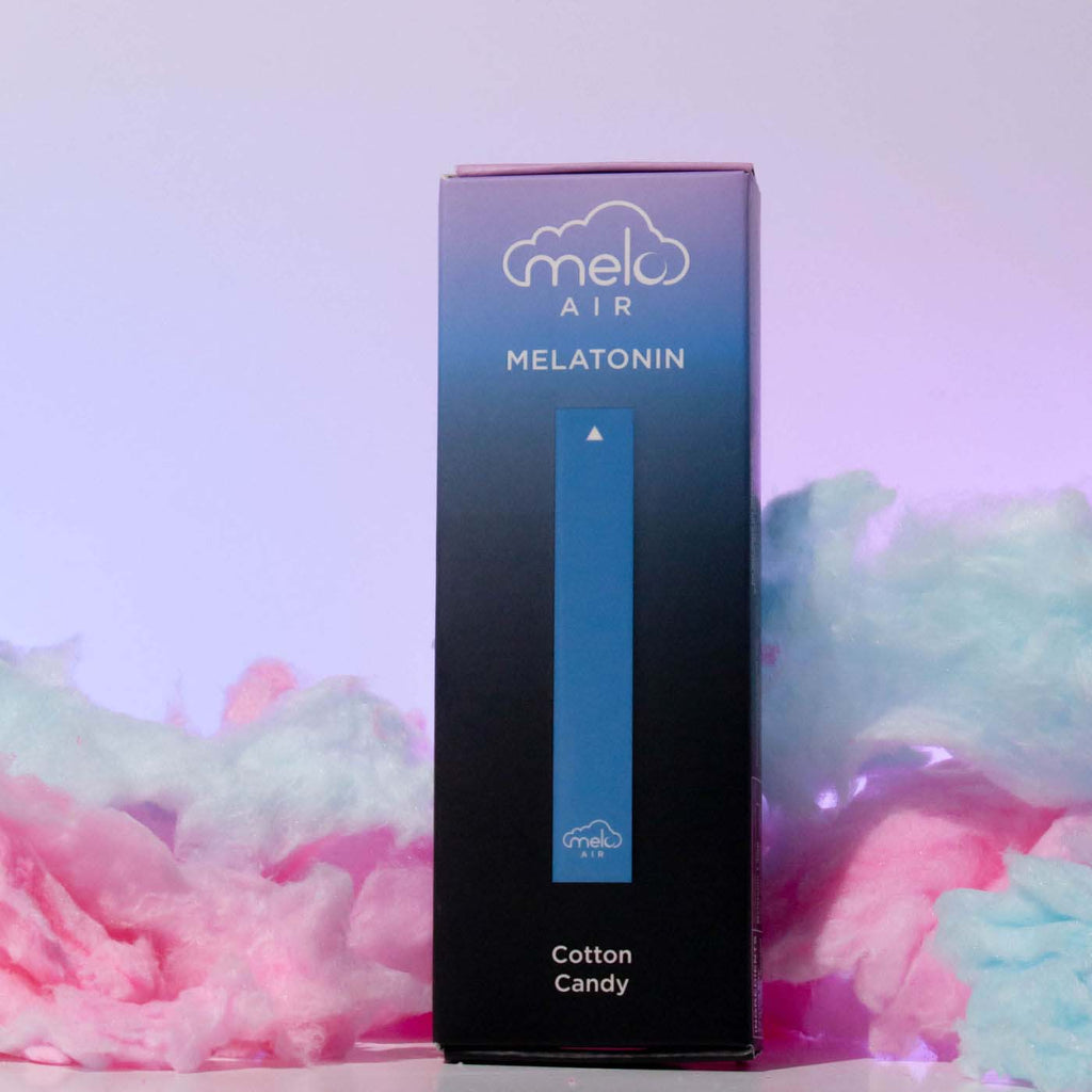 a box of MELO Air Melatonin Diffuser surrounded with colorful cotton candy