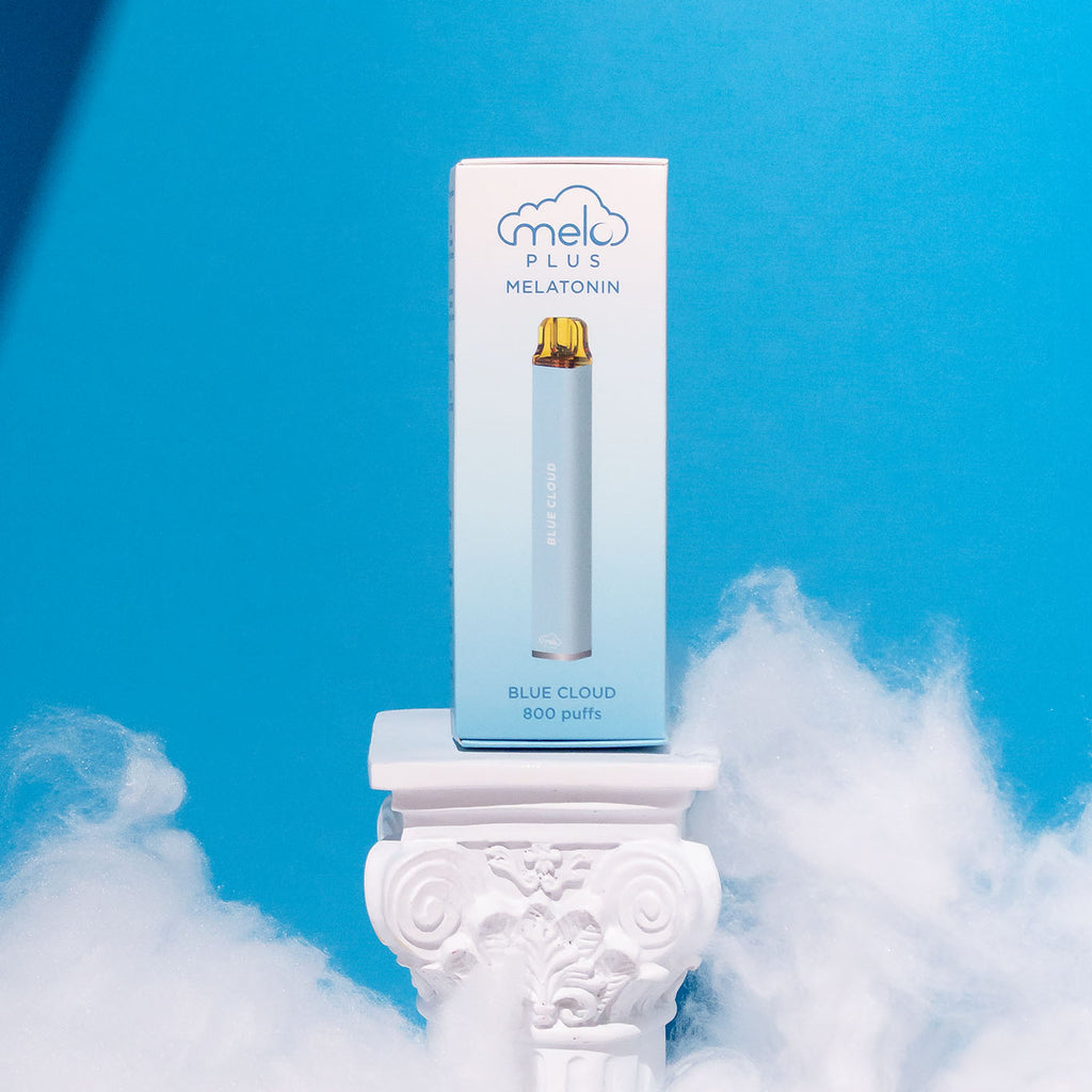 MELO Plus in Blue Cloud flavor placed on a white pedestal