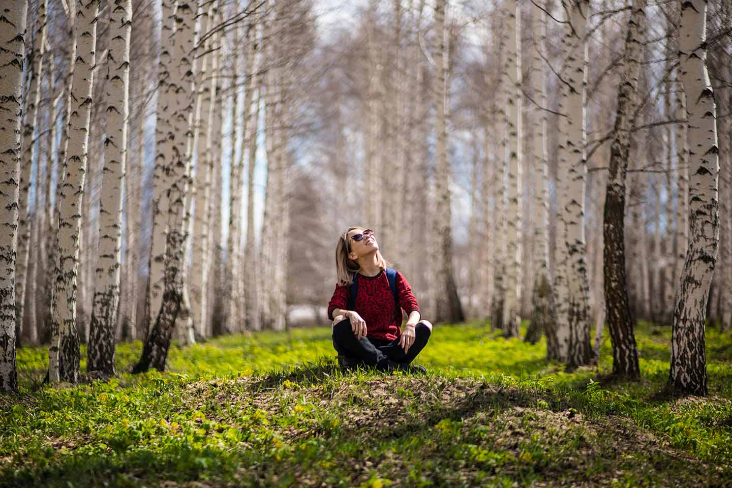 Woman sitting in a forest