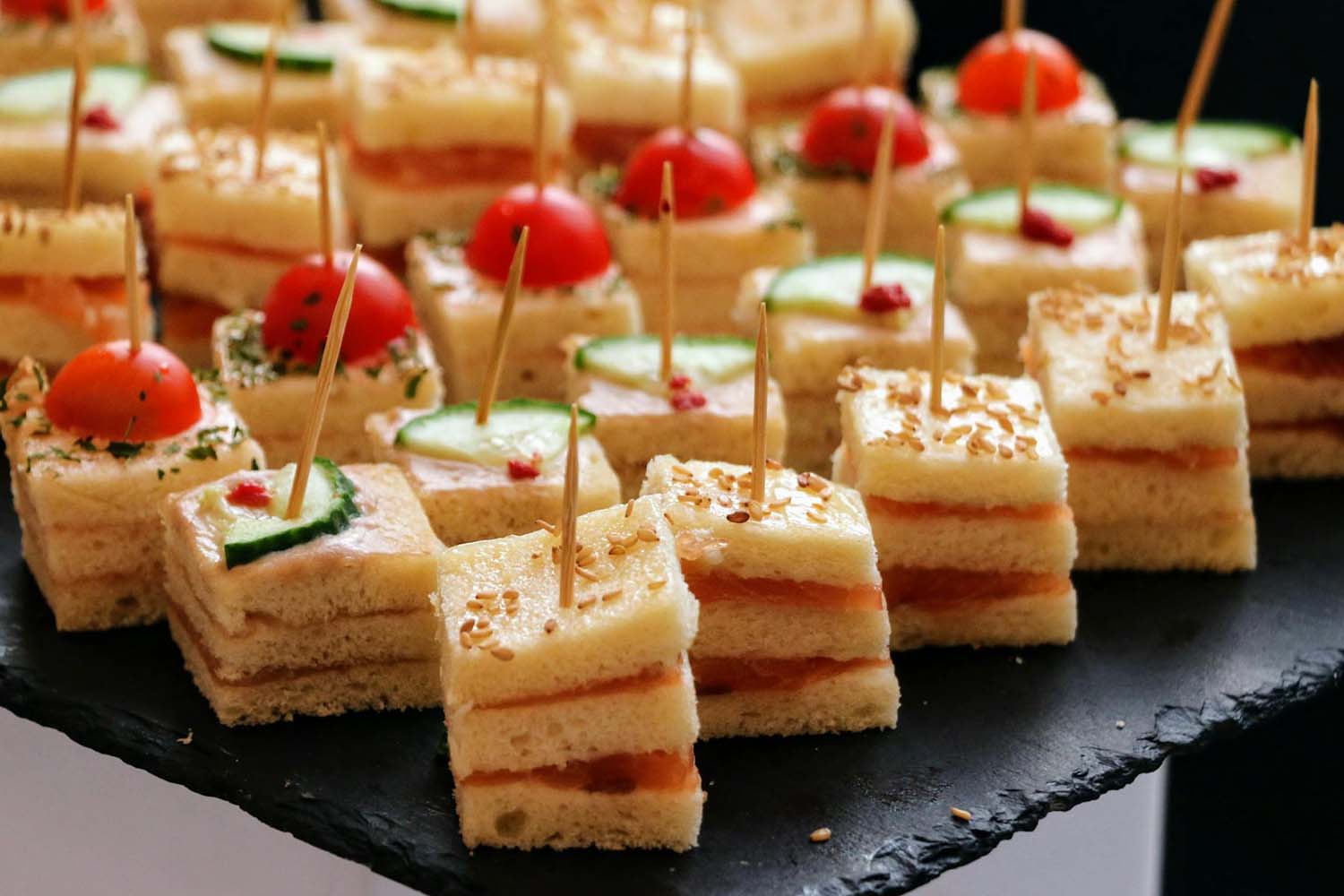 Assorted mini sandwiches with toothpicks