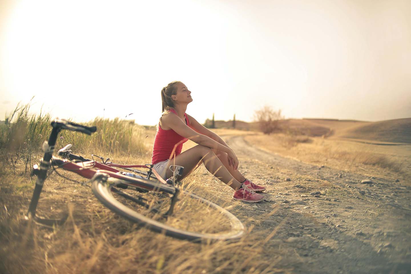 Woman resting with bicycle