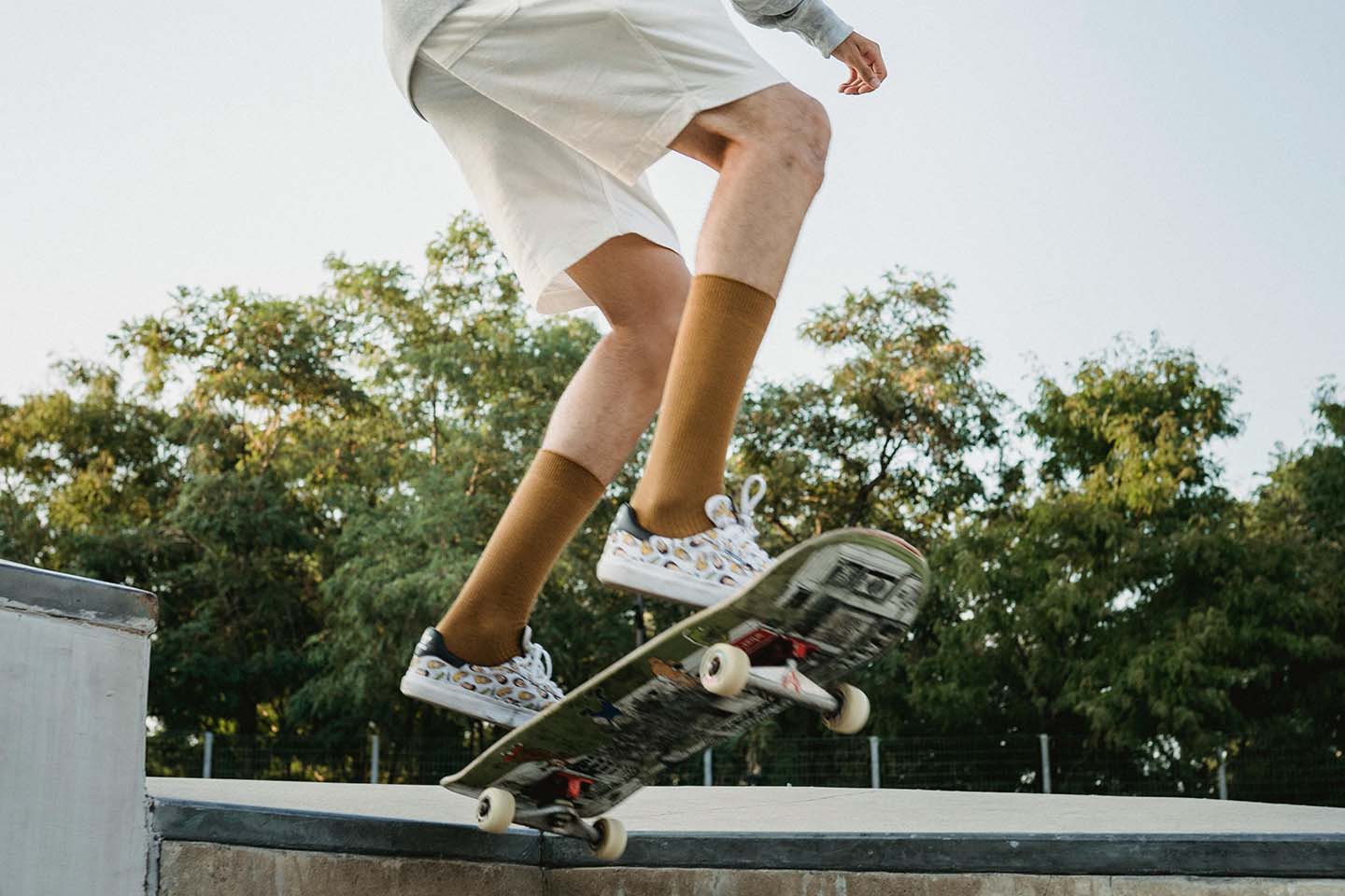 man jumping in the air on a skateboard