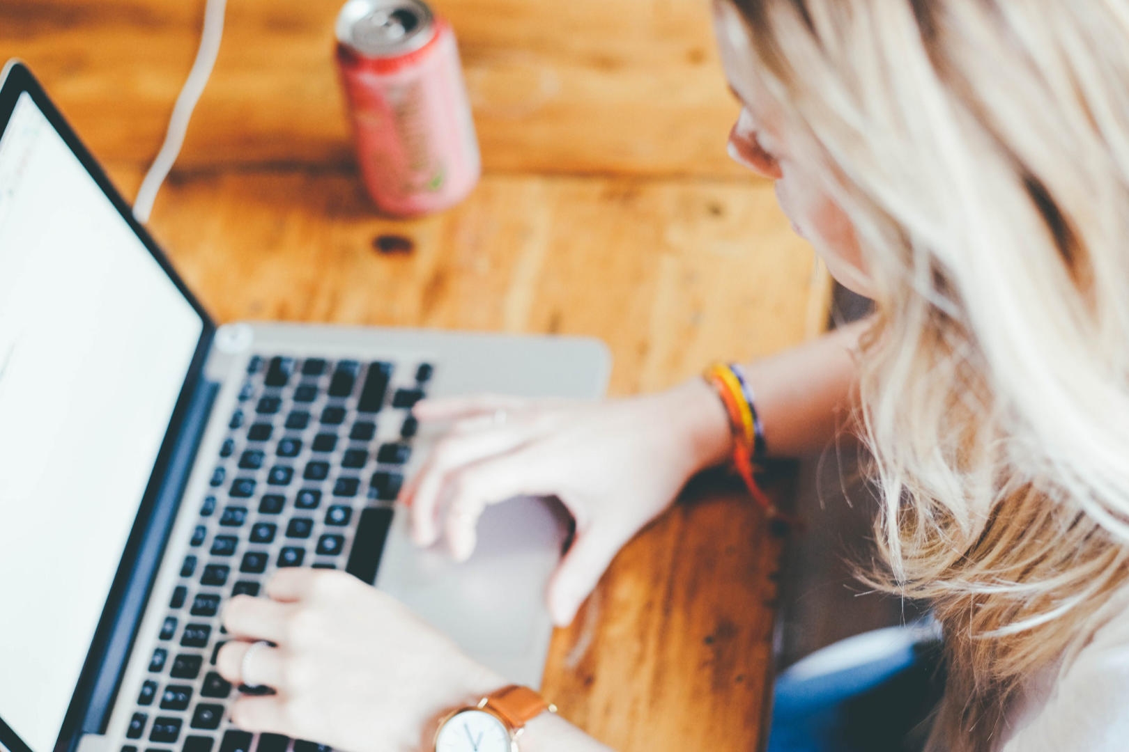 A woman working on her laptop.
