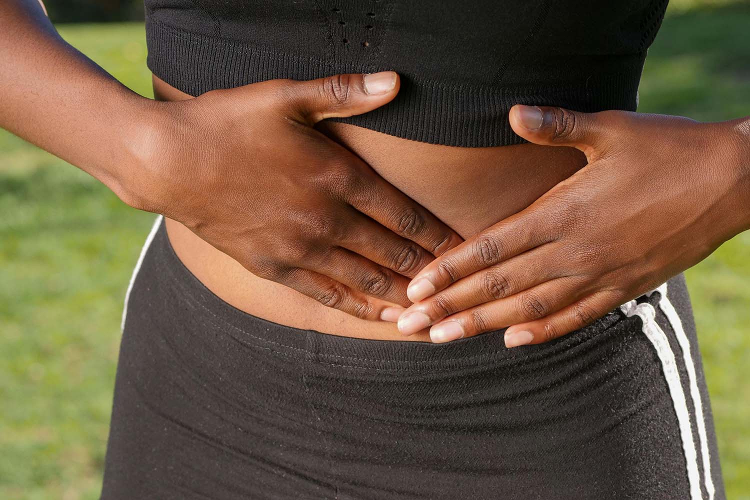 Woman touching her stomach