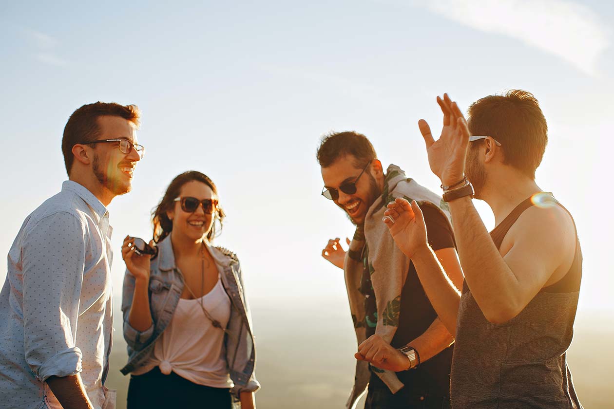 group of friends having fun together under the sun