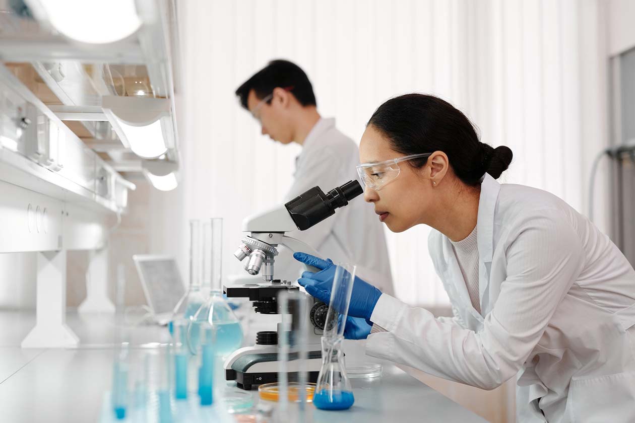 woman using a microscope