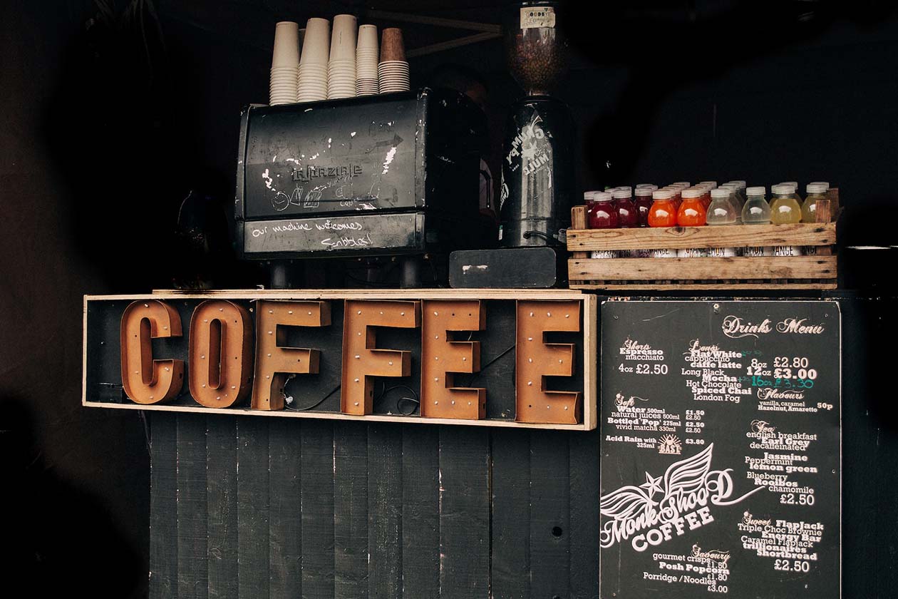 brown coffee signage in a coffee store