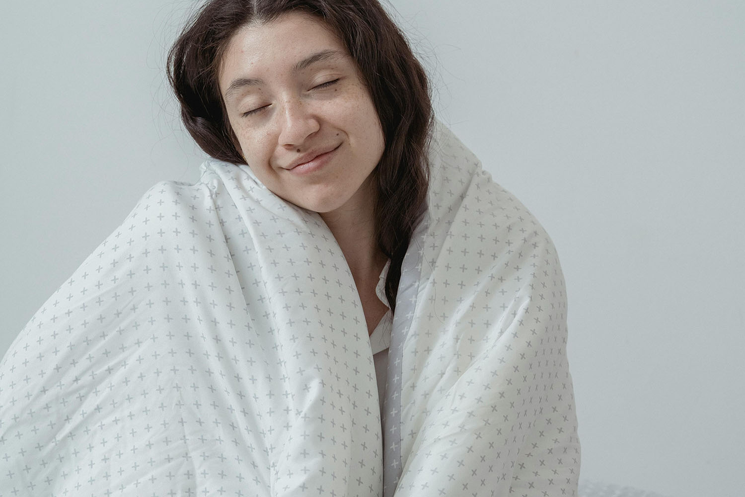 Woman covering herself in a blanket