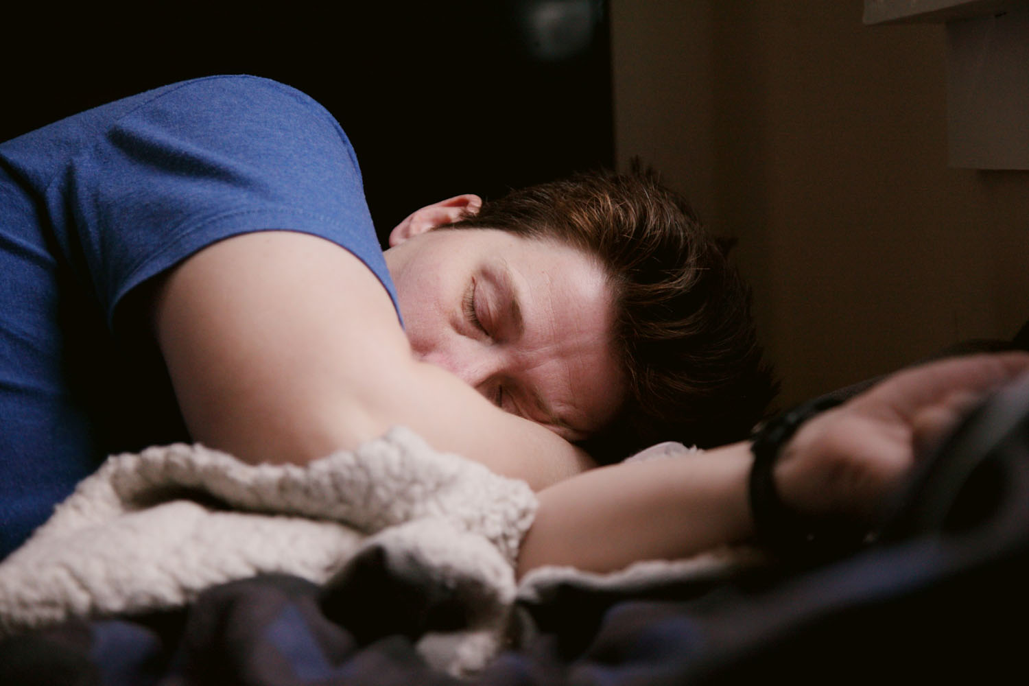Person laying asleep in bed
