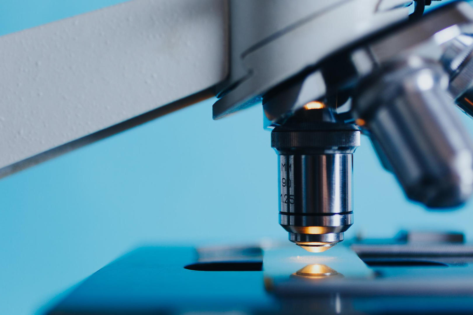 A close up shot of a microscope analyzing specimen