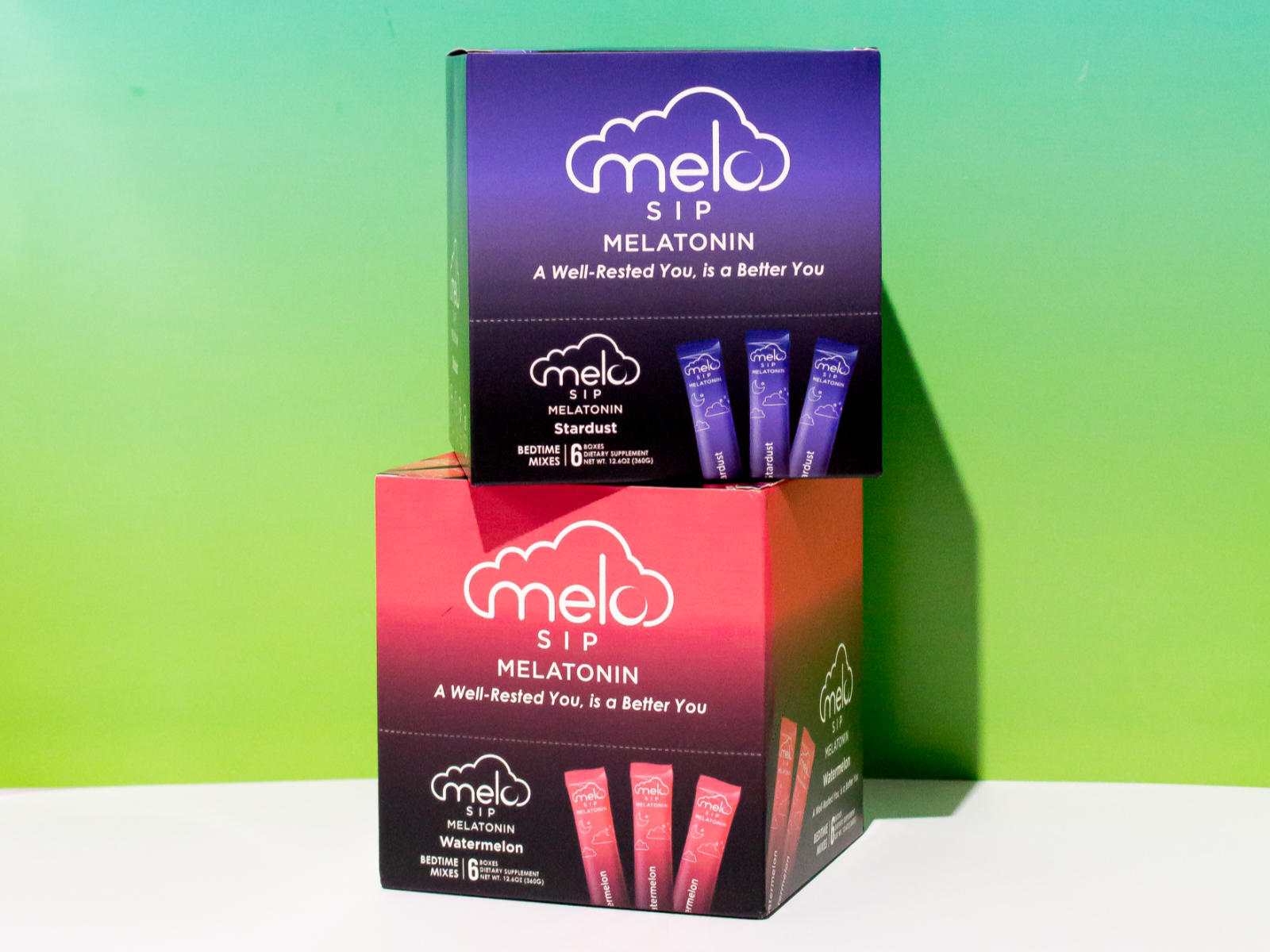 Two stacked boxes of Melo Sip melatonin powder drink in stardust and watermelon flavors.