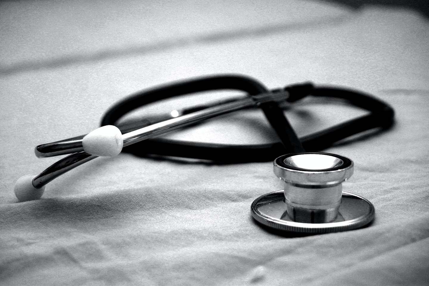 Black and white stethoscope on a piece of fabric