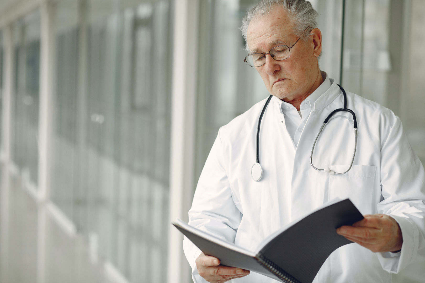 A doctor reading clinical records.
