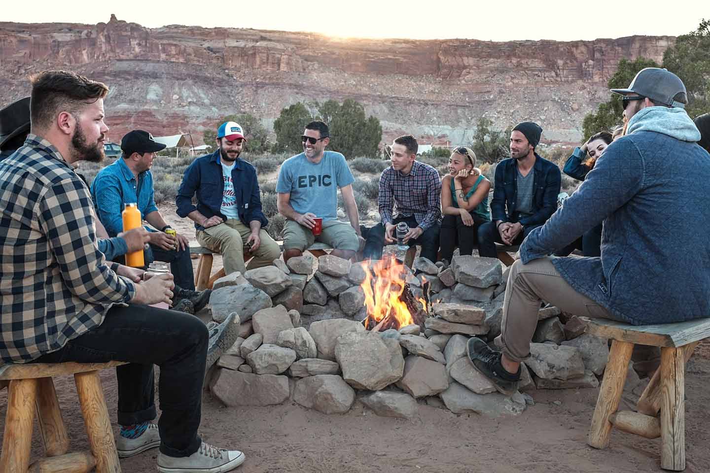 Friends sitting around a campfire
