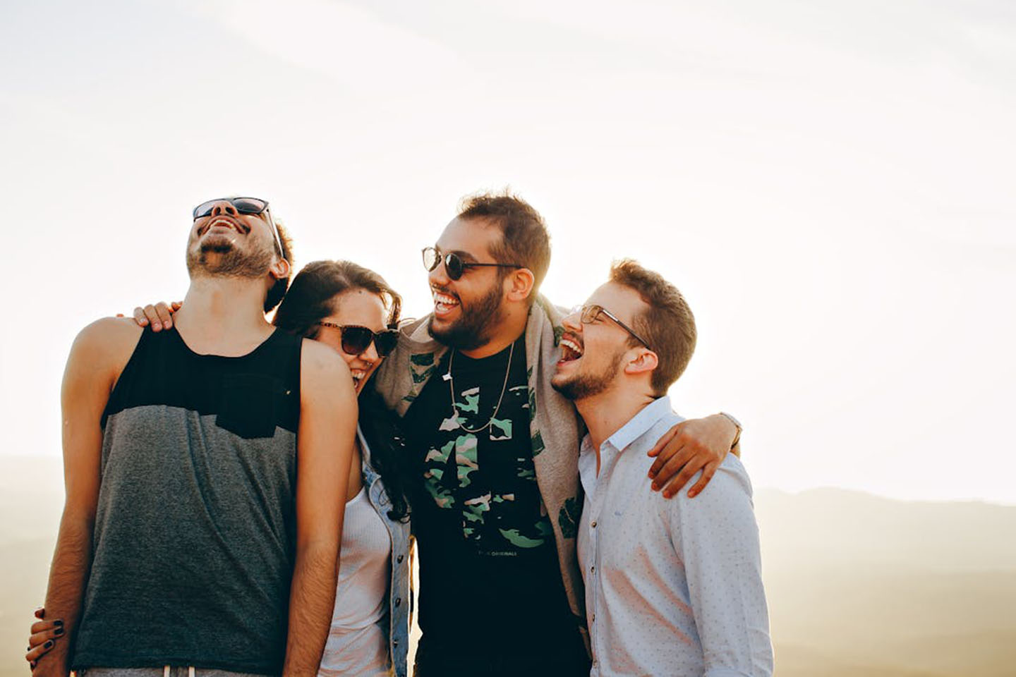 Four friends smiling